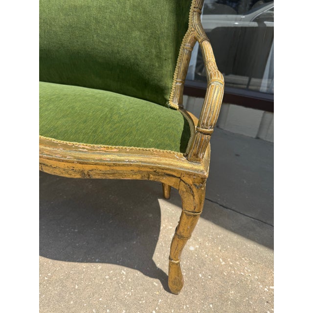 Old Italian gilded settee. New green velvet fabric. Faux bamboo gilded frame. Perfect for an entryway or at the end of...