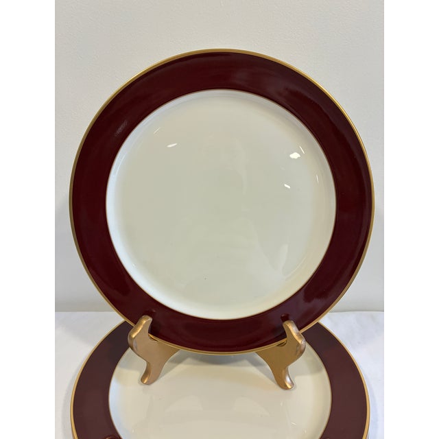 A classic set of four vintage dinner plates by Pickard in the Ensemble Burgundy pattern. Hand decorated in the USA, each...