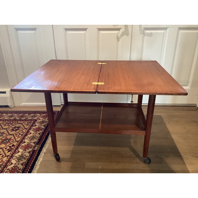 Wood 1970s Midcentury Modern Teak Rolling Expandable Table With Shelf For Sale - Image 7 of 12