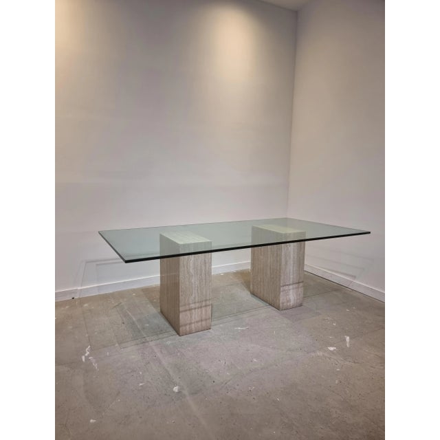 Postmodern piece in travertine marble that can be used as a writing desk or dining table. Fits 6 to 8 persons. The two...