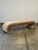 W77 D22.5 H19 Our sleek, sculptural designed waterfall bench upholstered in a soft cognac colored chenille with a subtle...