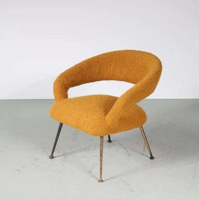 A lovely elegant easy chair, designed by gastone rinaldi and manufactured by rima in italy around 1950. The beautifully...