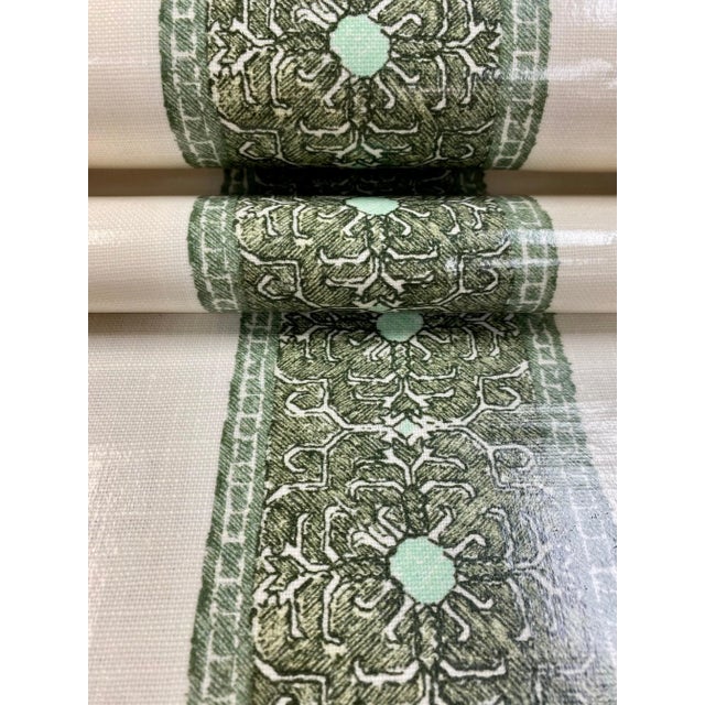 55" wide Katie McGloin Jaipur stripe laminated Belgian linen upholstery fabric in olive green and cream. Price is per yard.