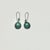 These are a lovely pair of faux turquoise drop/dangle earrings. They feature a Southwestern Aztec style with dark metal...