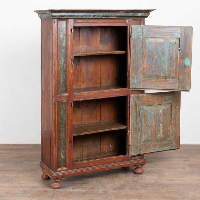 Original hand painted Swedish two door cabinet dated 1771, crafted in pine with a dark aged patina. The original painted...