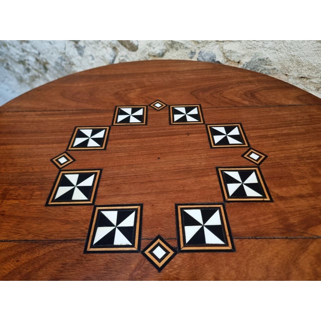 Distinctive French coffee table dating from the 1950s, crafted from solid hardwood and featuring a striking geometric...