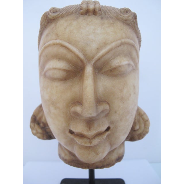 Rajasthan, India style, antique Jain sculpture depicting the head of a Tirthankara (a spiritual teacher or "ford-maker" in...