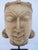 Rajasthan, India style, antique Jain sculpture depicting the head of a Tirthankara (a spiritual teacher or "ford-maker" in...