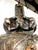 Cast bronze with a dark patination, the neo classical greek style urns with of typical form with handles and relief in the...