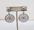 Circa 1973 rhodium plated round domed top with round flat openwork drop clip and adjustable screw back earrings. Marked...