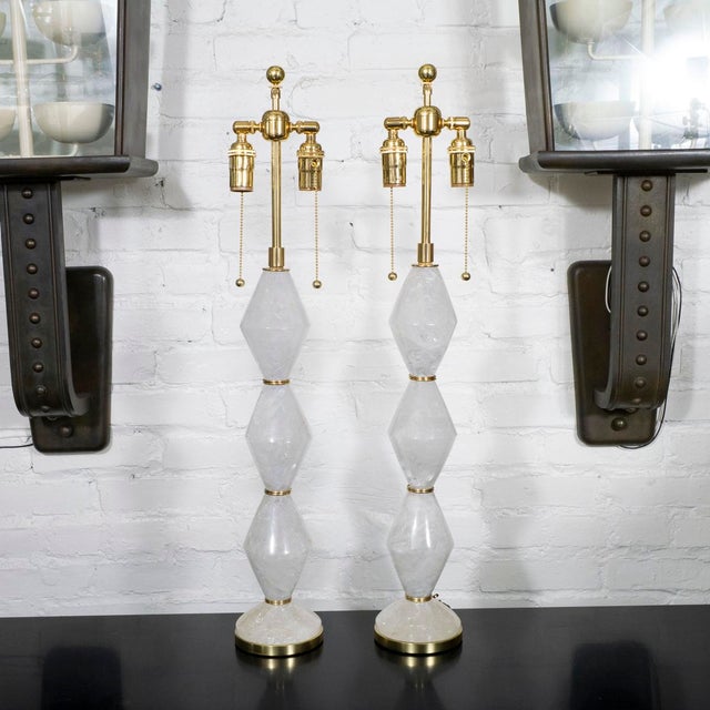 Pair of diamond shaped polished rock crystal table lamps with brass hardware by Spark Interior.