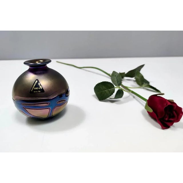 1960s. Made in glass. This vase features its original label and it signed by the maker. It is a vintage piece, therefore...