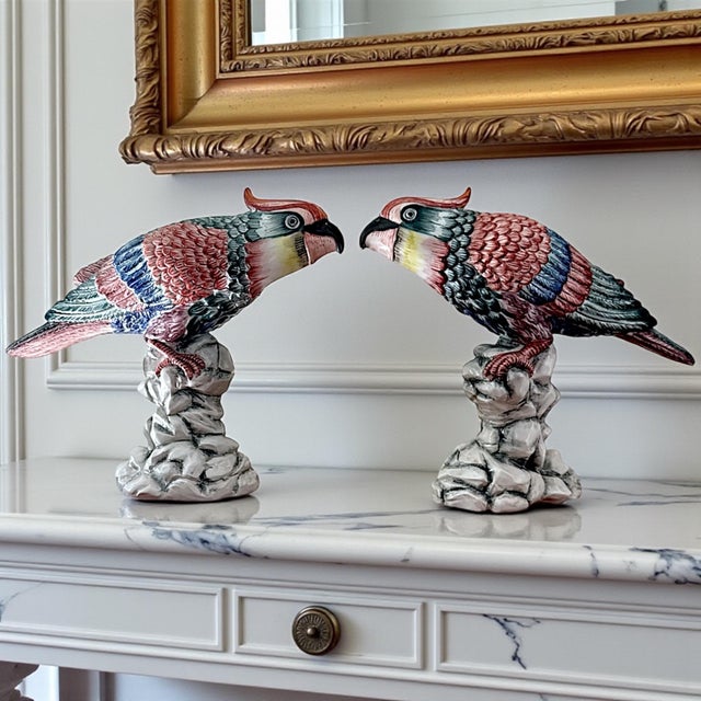 A beautifully preserved pair of Mottahedeh parrots from the Williamsburg Collection, crafted in Italy in 1998 and finished...