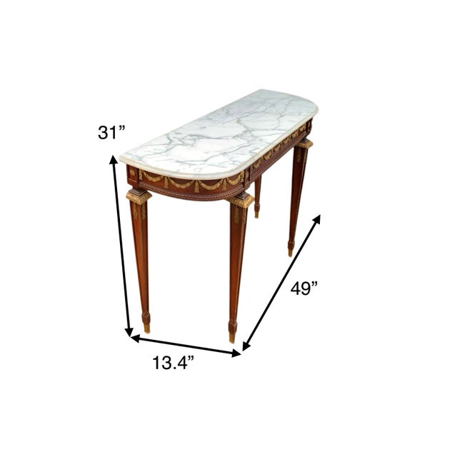 This Antique Neoclassical Paine Furniture console table is a stunning piece of furniture with a marble tabletop and gilt...