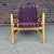 This is a authentic Jens Risom for Knoll strap lounge chair made in 2000. It has a maroon nylon strapping and champagne...