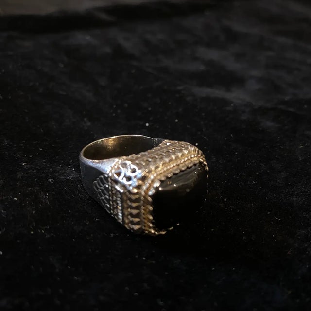 An amazing sterling silver and black onyx cocktail ring designed and manufactured in Italy by Anomis in the Nineties, the...