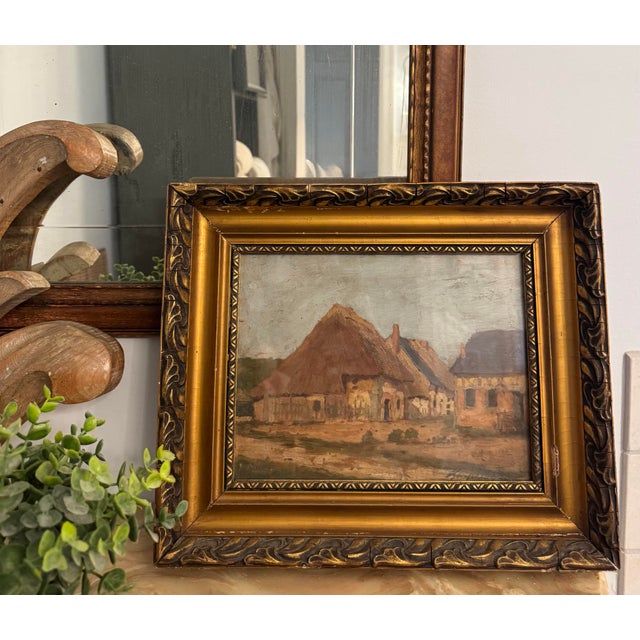 A signed landscape painting by Hungarian artist Jeno Karpathy, depicting a charming village scene. It is presented under...