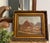 A signed landscape painting by Hungarian artist Jeno Karpathy, depicting a charming village scene. It is presented under...