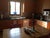 1990s Distressed-Painted Hard-Wood Dining Table With Four Cross-Backed Chairs Featuring Natural Hand-Woven Seats For Sale - Image 5 of 6