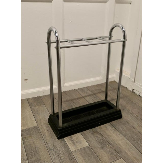 An Art Deco Chrome and Cast Iron Stick Stand or Umbrella Stand. A charming piece made in Chrome, the top is divided into 4...