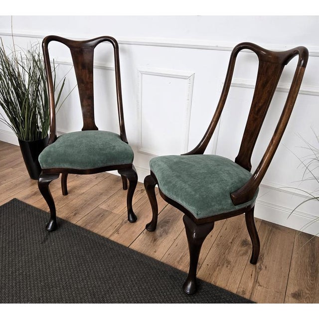 Very elegant Italian Mid-Century Modern set of 6 dining chairs, with greatly shaped wooden structure and upholstered seat....
