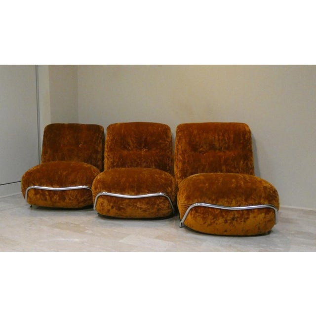 Modular living room set consisting of a set of three identical armchairs joined to form a three-seater sofa or a two-...