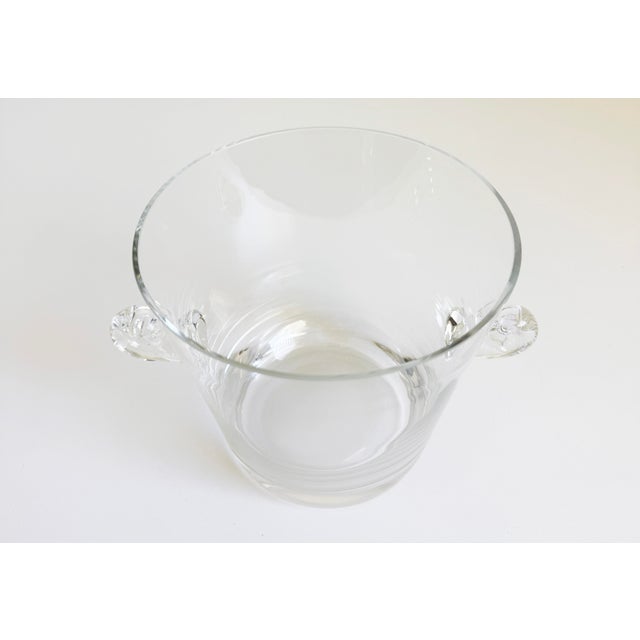 An elegant crystal ice bucket produced by Tiffany & Co., featuring distinctively styled applied scroll handles. Great for...