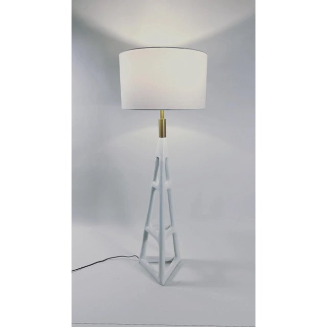 Contemporary hand-textured floor lamp with brass accents and white drum shade. 3-way cast turn knob E26 bulb 8’ cord...