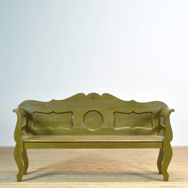 A charming, authentic Hungarian bench in its original paint from circa 1900 — a beautiful piece of craftsmanship with...