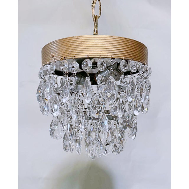 A charming celebration of vintage glamour, this elegant crystal chandelier brings sparkle and sophistication to any...