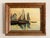 Vintage oil painting on canvas board of a sailboat in harbor. Signed to the lower right, Jack McCartney. In original...