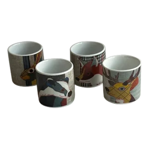 Egg Cups With Animals and Plaid Background