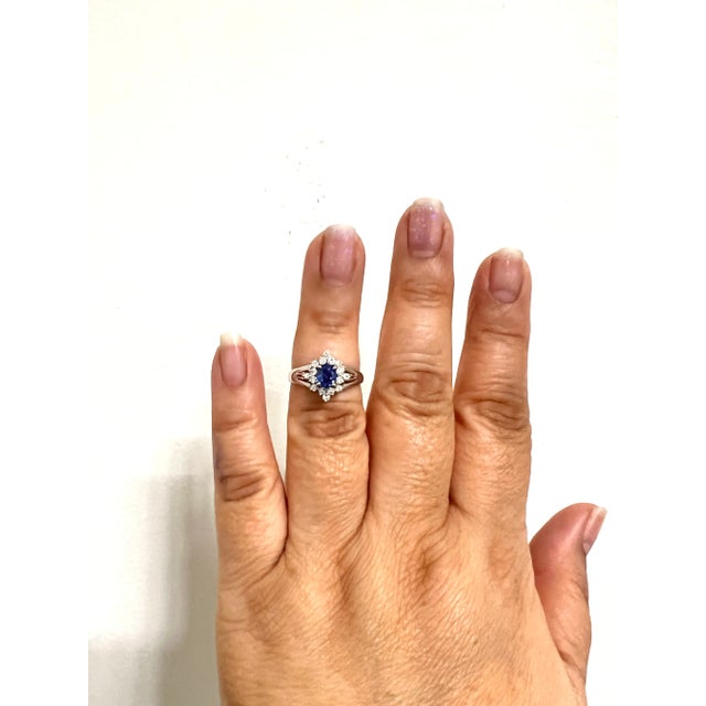 Gorgeous 0.61 ct. blue sapphire oval with 0.33 ct. white diamond rounds. Handmade in platinum. Ring size 6.5.