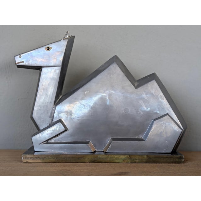 Rare mid-century cubist camel sculpture in pewter with brass accents. This is the same sculpture design that graced the...