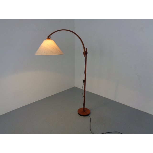 Adjustable teak floor lamp by Domus. Height from 130 cm to a maximum of 160 cm. This piece has an attribution mark, I am...