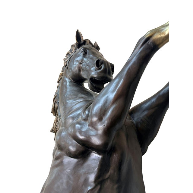 Monumental rearing horse sculpture featuring an extraordinarily dynamic pose, muscular anatomical detailing, and rich...