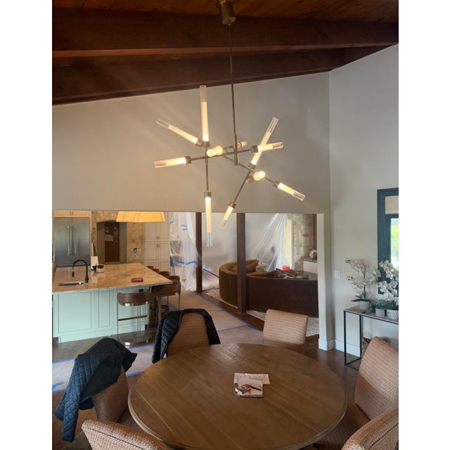 There are two mid century sputnik chandeliers. There are solid brass with patina. They are modifiable with how they are...