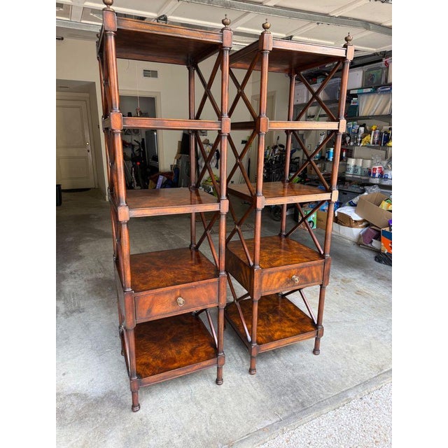 Pretty flamed mahogany étagères with X side detail, decorative medallions and finials in painted wood. A single drawer on...