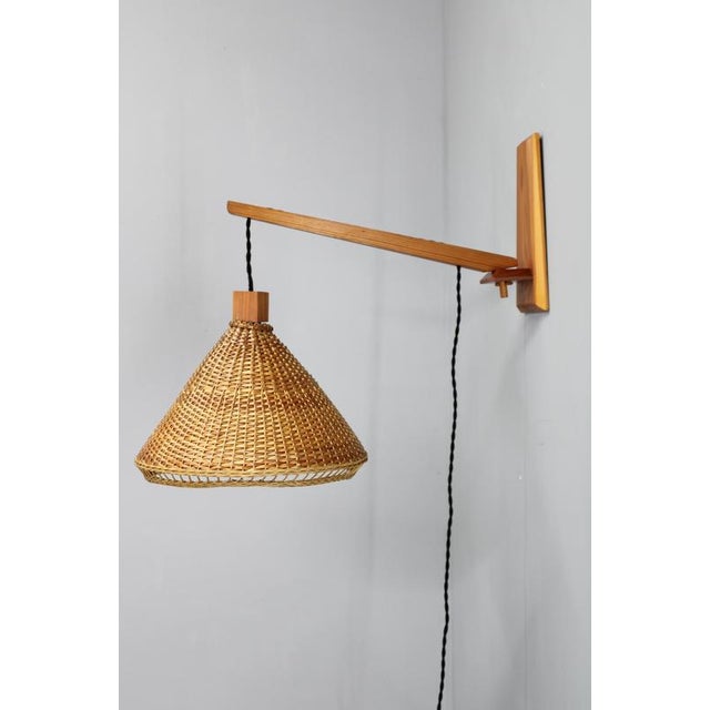 This mid-century wall light was produced in czechoslovakia in the 1970s and features a beautifully balanced construction...