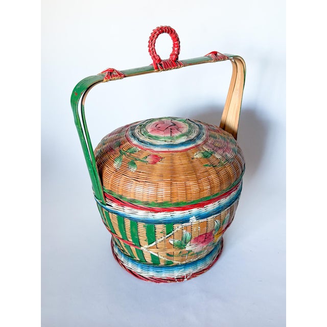 A lovely, brightly hand painted Chinese wedding basket. It features painted green stripes and motifs of flowers and...