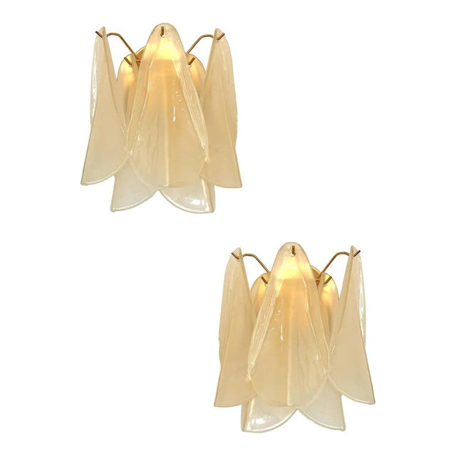 Scenographic and luxury murano glass wall sconces. “rondini” elements in murano glass poured over a mold from a...