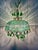 Empire-style chandelier frame, adorned with green and lilac beads. Crystal and green crystal details. Up to 250V...