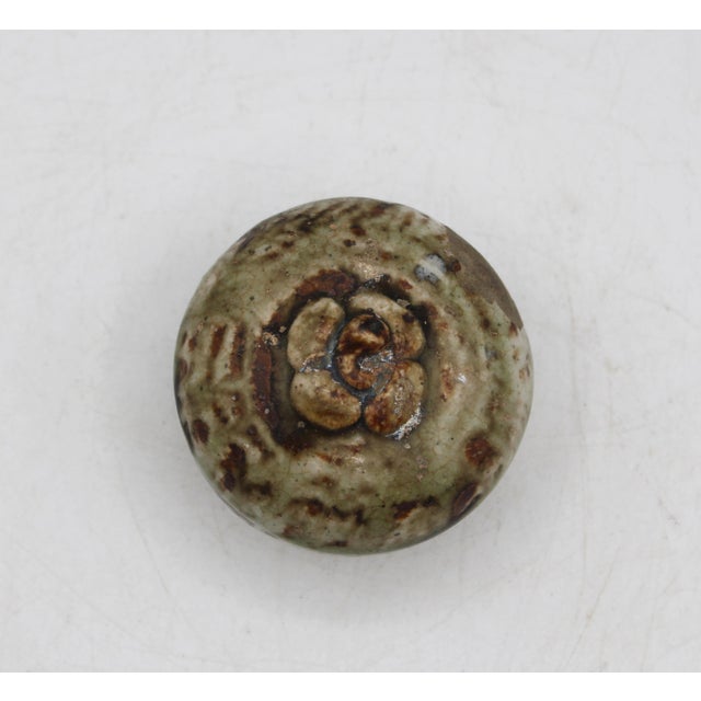 Thai Sawankhalok small stoneware persimmon shaped box, 15th century. Naturalistic body, carved lid & an intriguing repair...