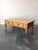 An antique English pine coffee table with a reclaimed pine top and turned legs. Drawers with wooden knobs for extra...