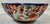 Antique Scalloped Rim Imari Bowl Decorated With Vibrant Floral Patterns in Shades of Pink, Orange & Red Measures 7 1/4” W...