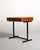 Modernist writing desk with a rectangular teak top and case, featuring two handleless drawer fronts. Simple black-painted...