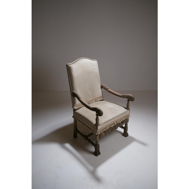 This imposing French armchair is executed in the Louis XIII style, with an architectural frame, generously turned...