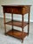 An elegant traditional occasional or side table crafted in richly toned mahogany with finely detailed inlaid oval...