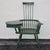 This mid-century comb back traditional Windsor style chair was built with a small desktop on the right arm, complete with...