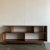 W72 D13 H32 Walnut bookcase made in a mix of solid and walnut veneer. Item is structurally sound and sturdy.